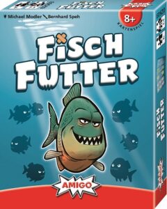 Das Cover des Gesellschaftsspiels Fischfutter zeigt einen grinsenden Piranha im Comicstil.