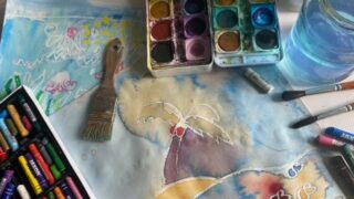Aquarelfarbe und Ölkreide, Pinsel und Farben